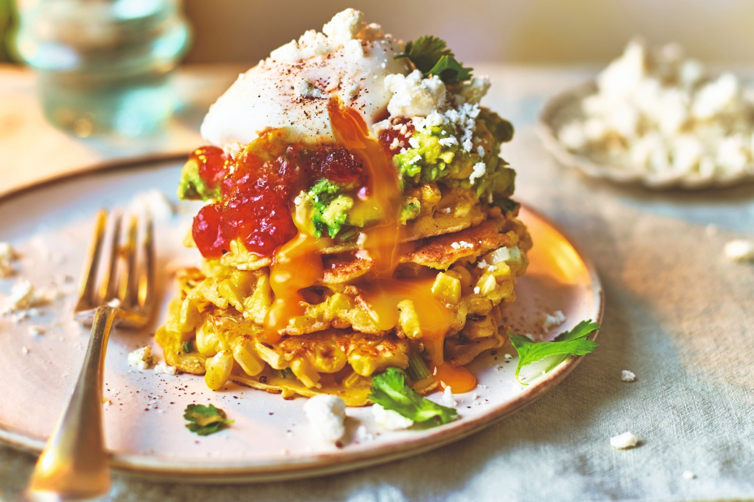 Summery sweetcorn fritters with smashed avocado and poached eggs