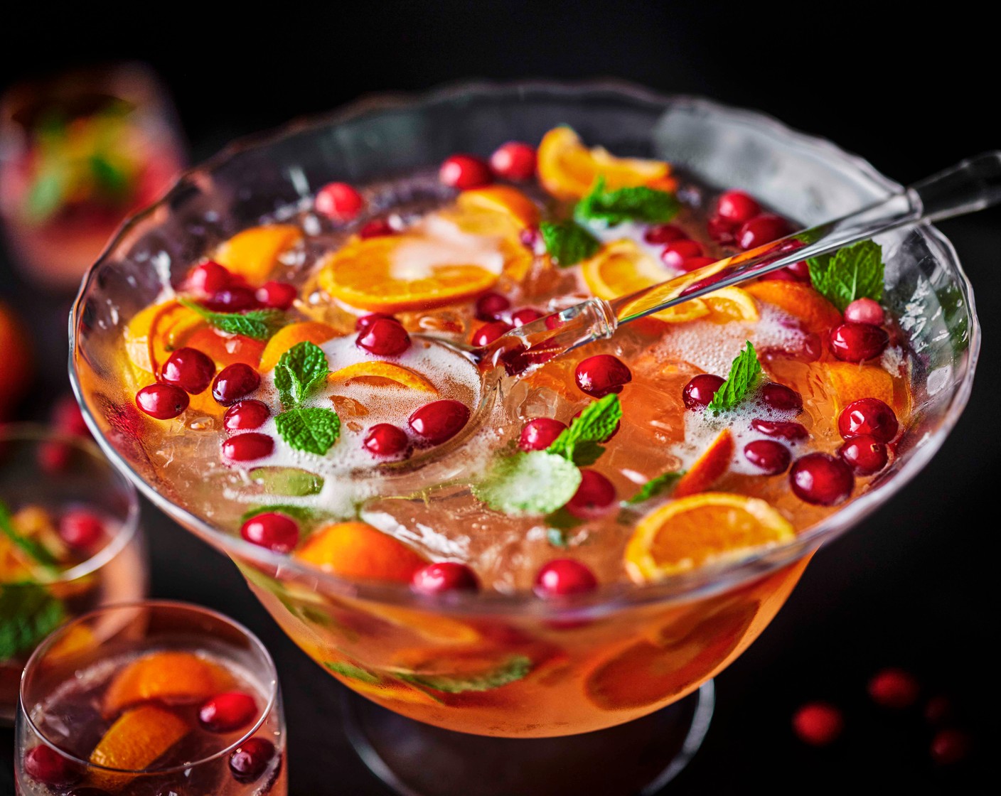 step 3 Ladle into glasses, with some of the easy peelers and cranberries from the punch for garnish.