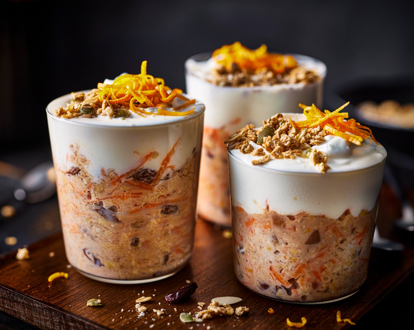 step 2 The next day, top with the yogurt (4 tbsp) and granola (4 tbsp) and top with the remaining orange zest (1/2).