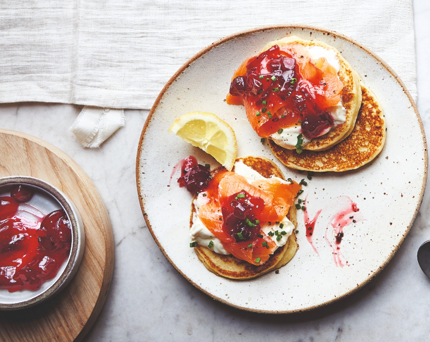 step 3 Serve with the crème fraîche (2 tbsp), M&S Collection festive chutney (2 tbsp), smoked salmon (1 pack) and lemon wedges (1).