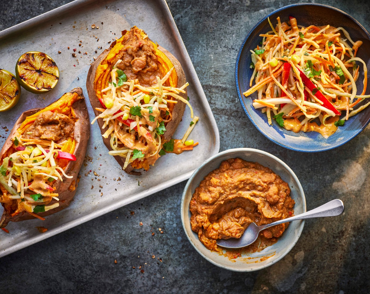 step 4 Serve the potatoes with the refried beans, slaw and lime for squeezing on top.