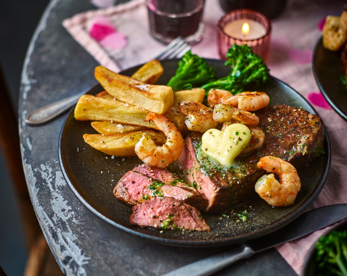 step 6 Serve the steak with the prawns on top and the green beans (to taste) and chips (to taste) on the side. Add a few of the truffle butter cut-outs to the steak, prawns and green beans.