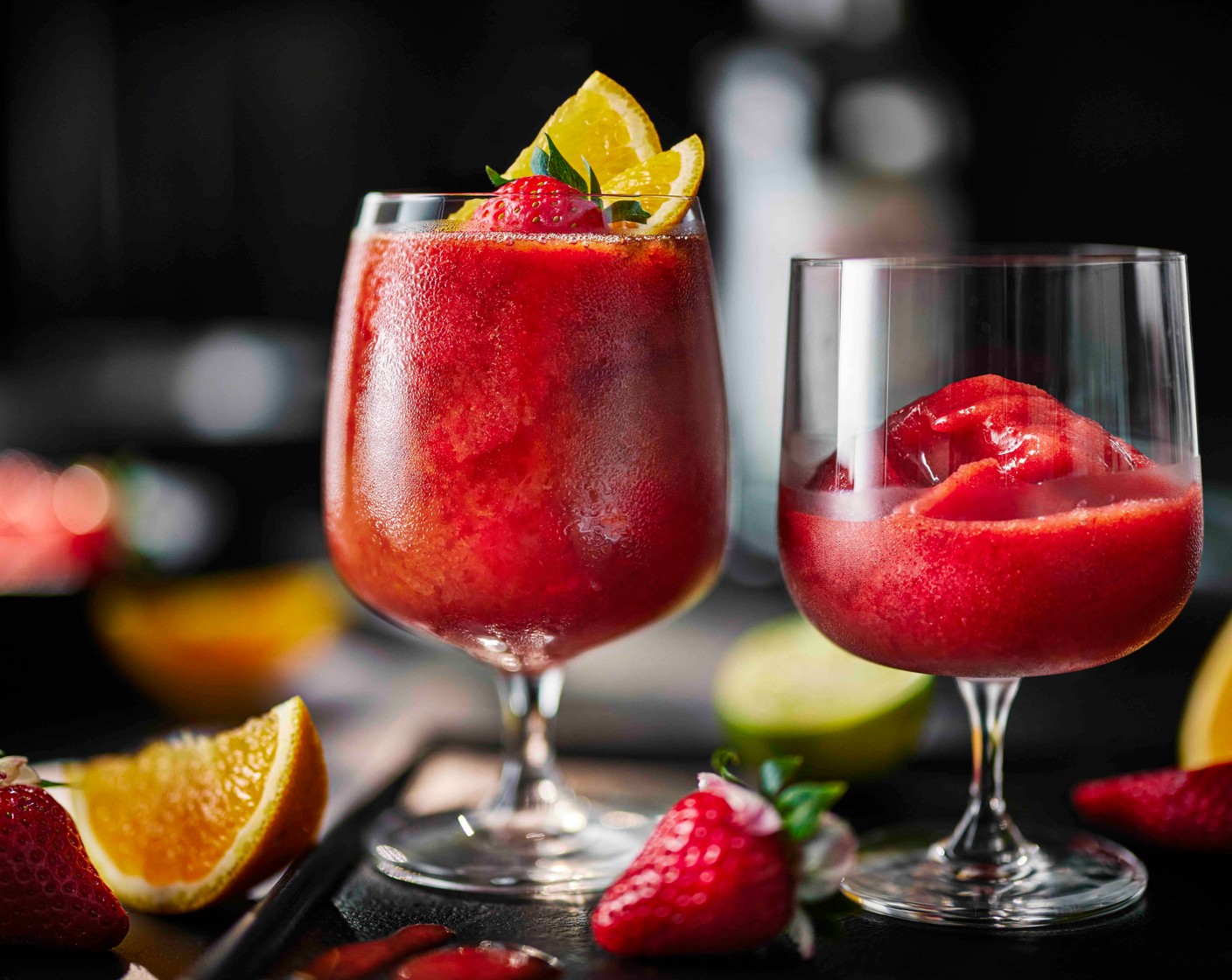 step 2 Pour the Pimm's (100 ml) over blended ice mixture in the glasses and gently stir, then top up with the lemonade (200 ml) and gently stir again. Garnish with strawberries (4) and orange slices (1/2).