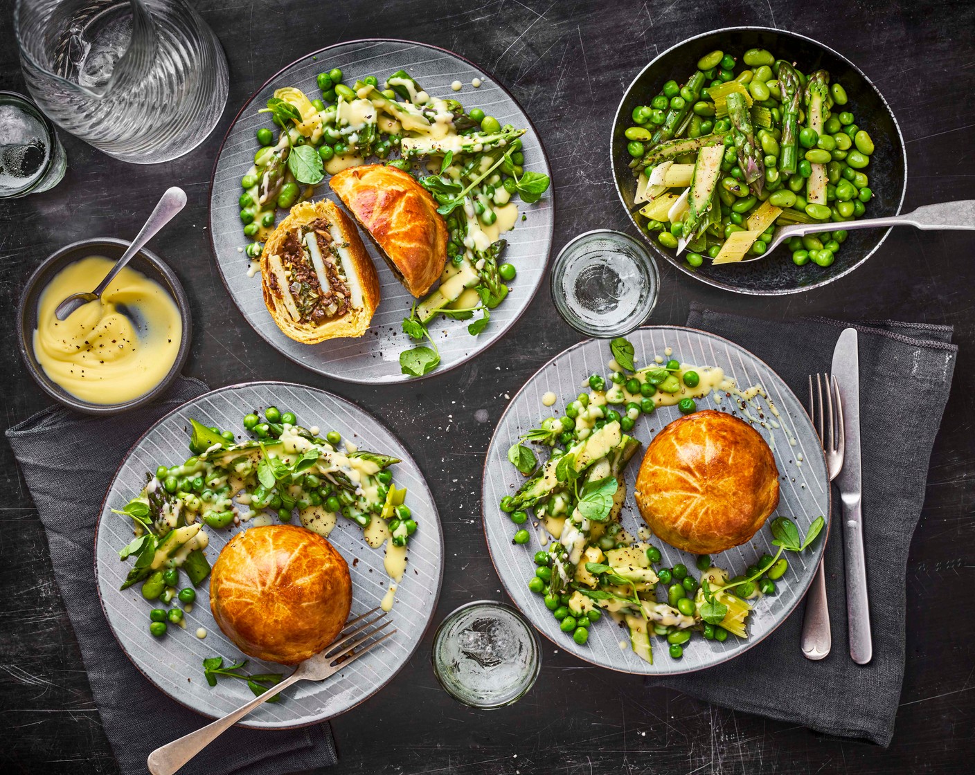 step 13 To serve, use the vibrant green garnish to make a decorative circle on the plate and drizzle over the beurre blanc. Place the pithivier into the centre of the circle, and garnish with pea shoots (100 g).