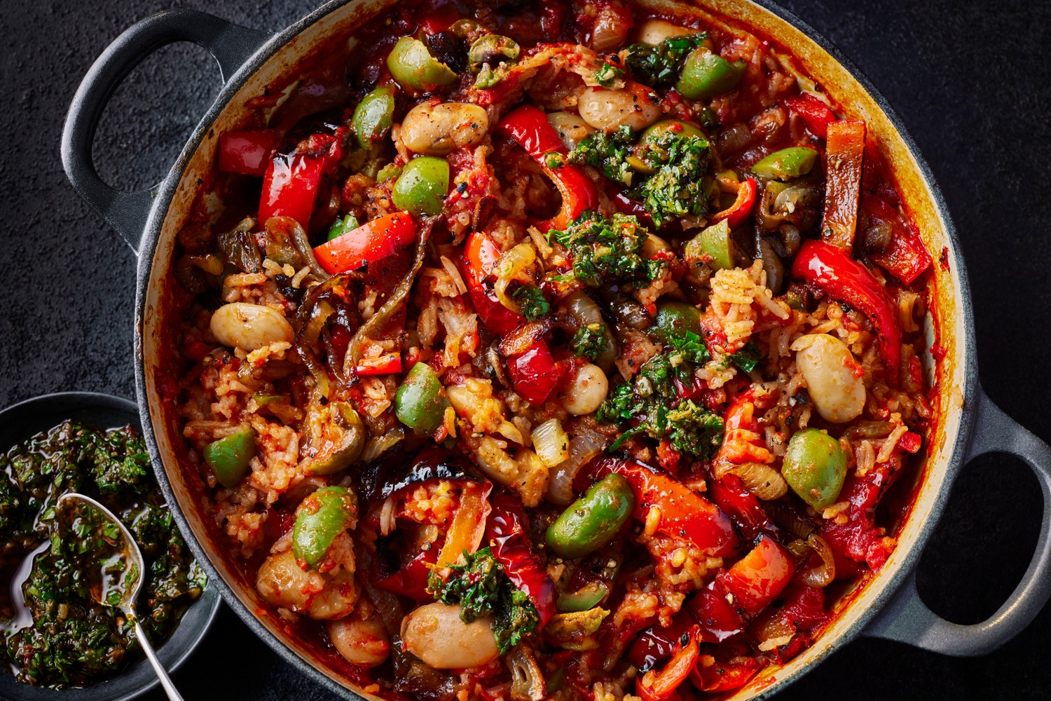 Tomato, rice, olive and butterbean traybake with chimichurri