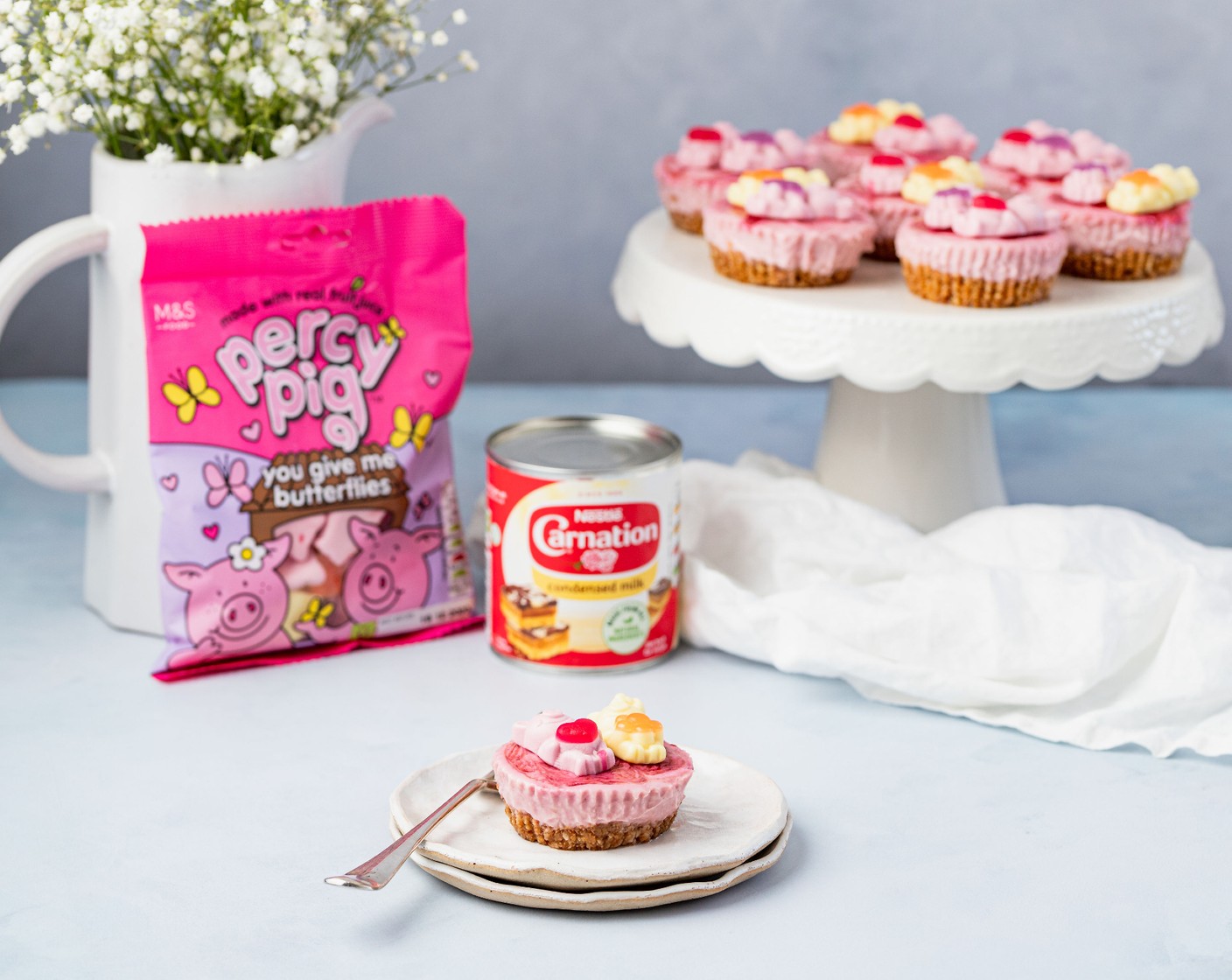 step 6 Pop back into the fridge for 2 hours to chill. When ready to serve, remove the paper liners and for the finishing touch, top each cheesecake bite with a Percy Pig butterfly (170 g).