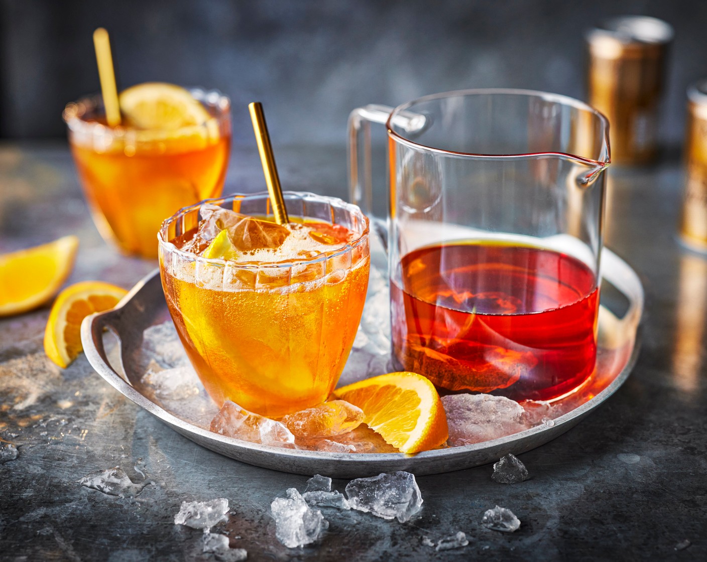 step 2 The next day, pour the tea-infused gin over four glasses filled with ice (4 handfuls). Squeeze the juice of one wedge of orange (1) into each glass. Top up with tonic (500 ml) and garnish each glass with another orange wedge.