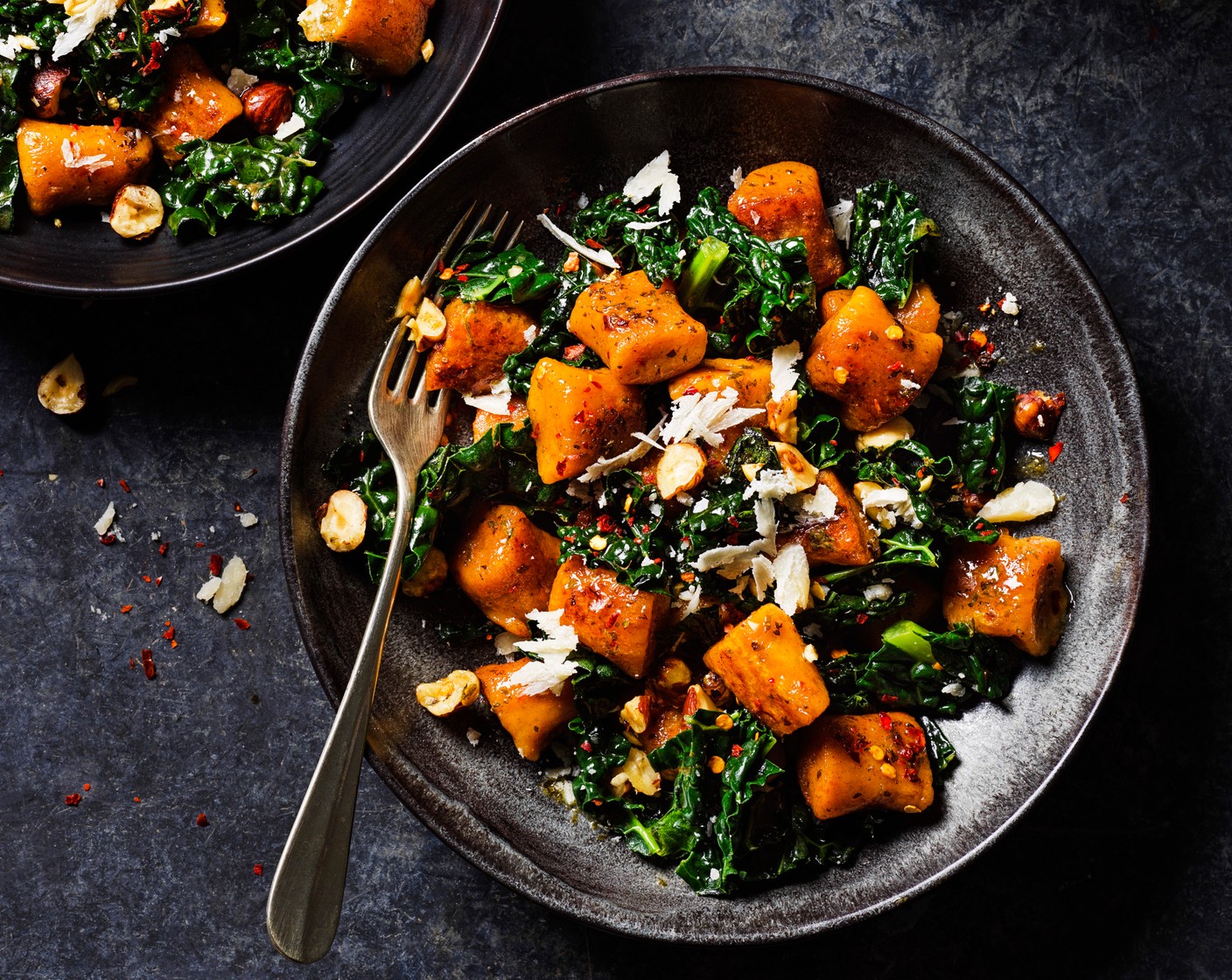 step 7 Serve in bowls, topped with the hazelnuts (1 handful) and more parmesan.