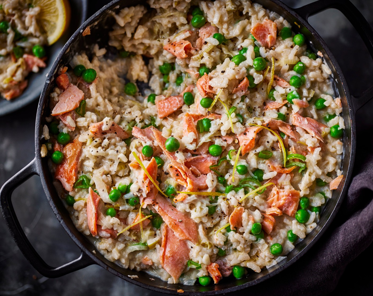 step 4 Stir in the peas (175 g), trout (200 g), garlic and herb butter (1 knob) and crème fraîche (3 tbsp), then return to the oven for a further 2 minutes. Serve with the lemon zest (1) on top.