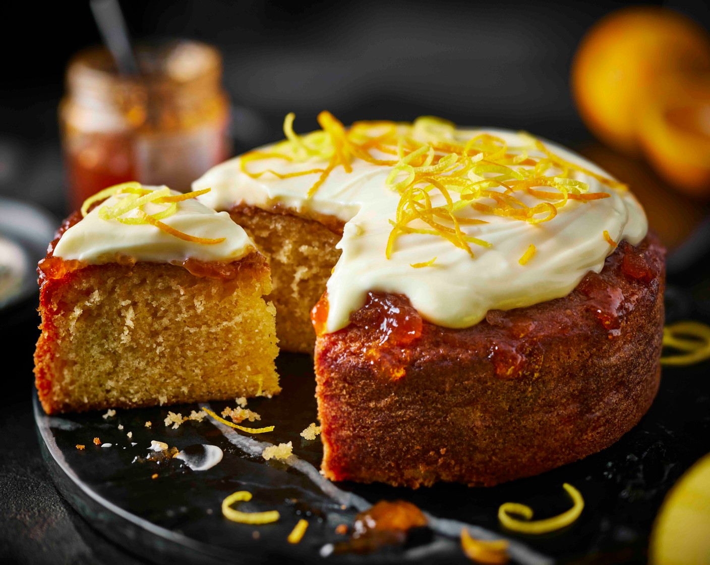 step 8 Spread the icing over the cooled cake then finish with some more lemon and orange zest, if you like.