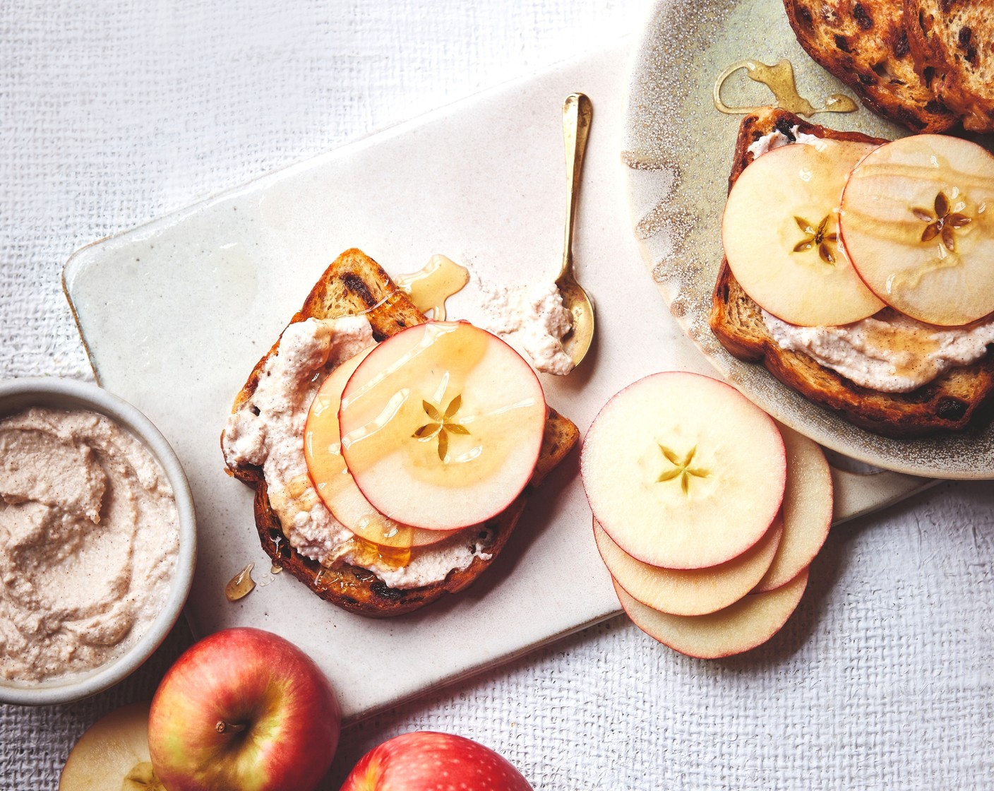 step 3 Toast the fruit bread (4 slices), then top with the honey and cinnamon ricotta, apple slices and a drizzle of extra honey, if you like.