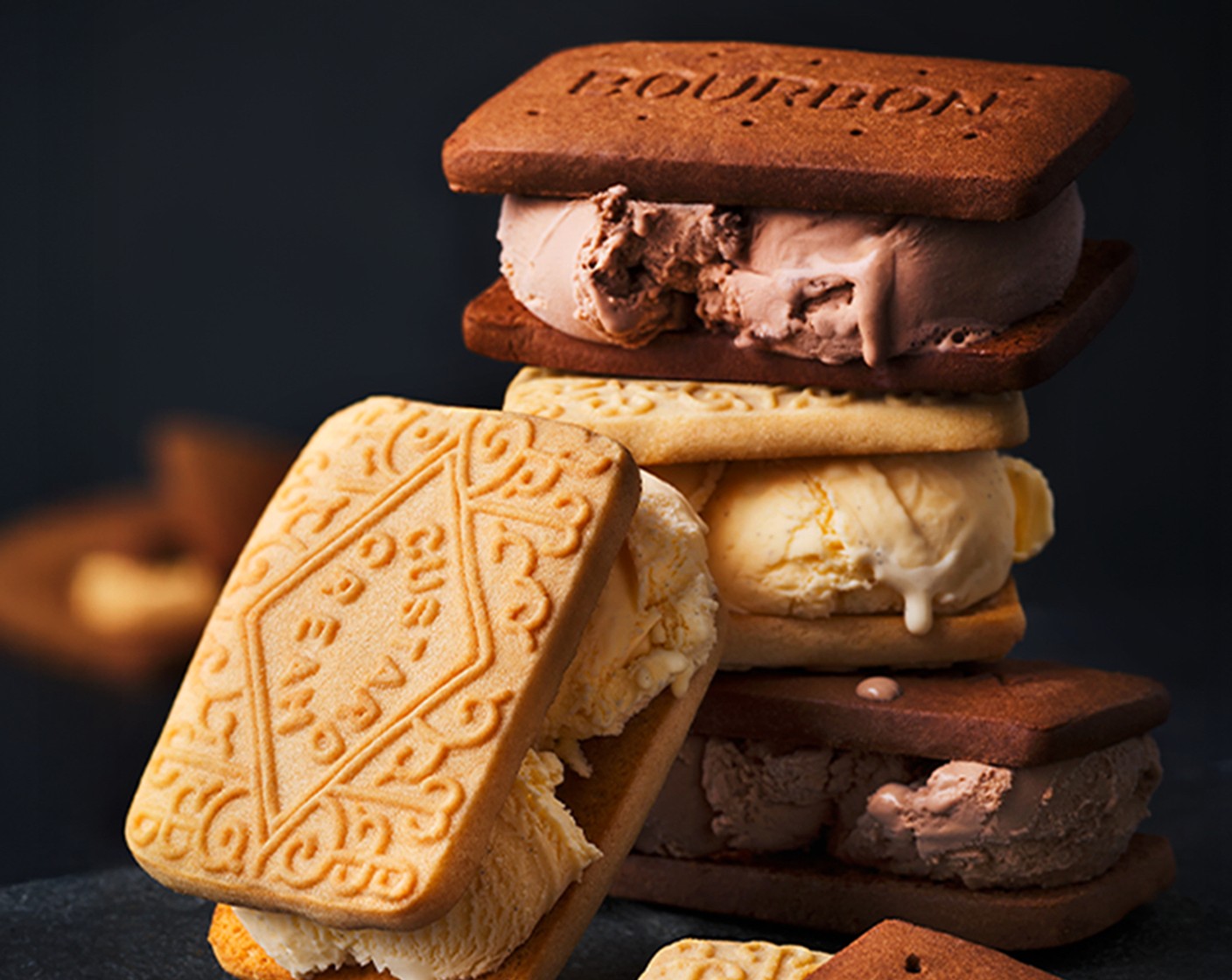 step 3 Spread 2 tbsp of vanilla ice cream onto one custard cream (1 pack). Smooth over with a spoon and sandwich another giant custard cream biscuit on top. Repeat with the remaining biscuits.
