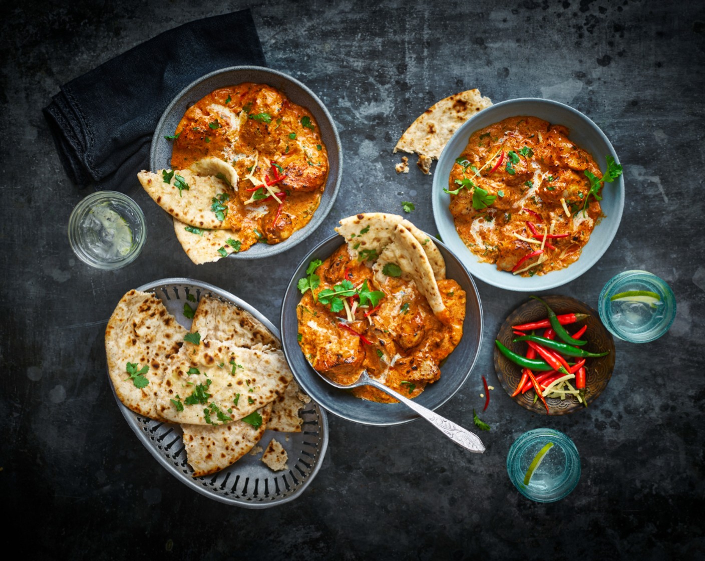 step 9 Divide the tikka masala between serving dishes and serve each with a roti. Top the tikka masala with the coriander (1/2 handful), red chilli (1), ginger (1 piece) and double cream (4 tbsp).