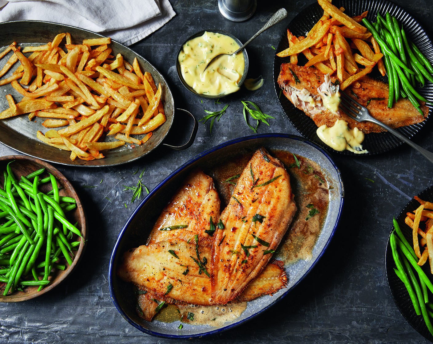 step 9 To serve, place the fish on a plate and pour over some of the warmed brown butter, capers and parsley (to taste), alongside the green beans, chips and aioli.