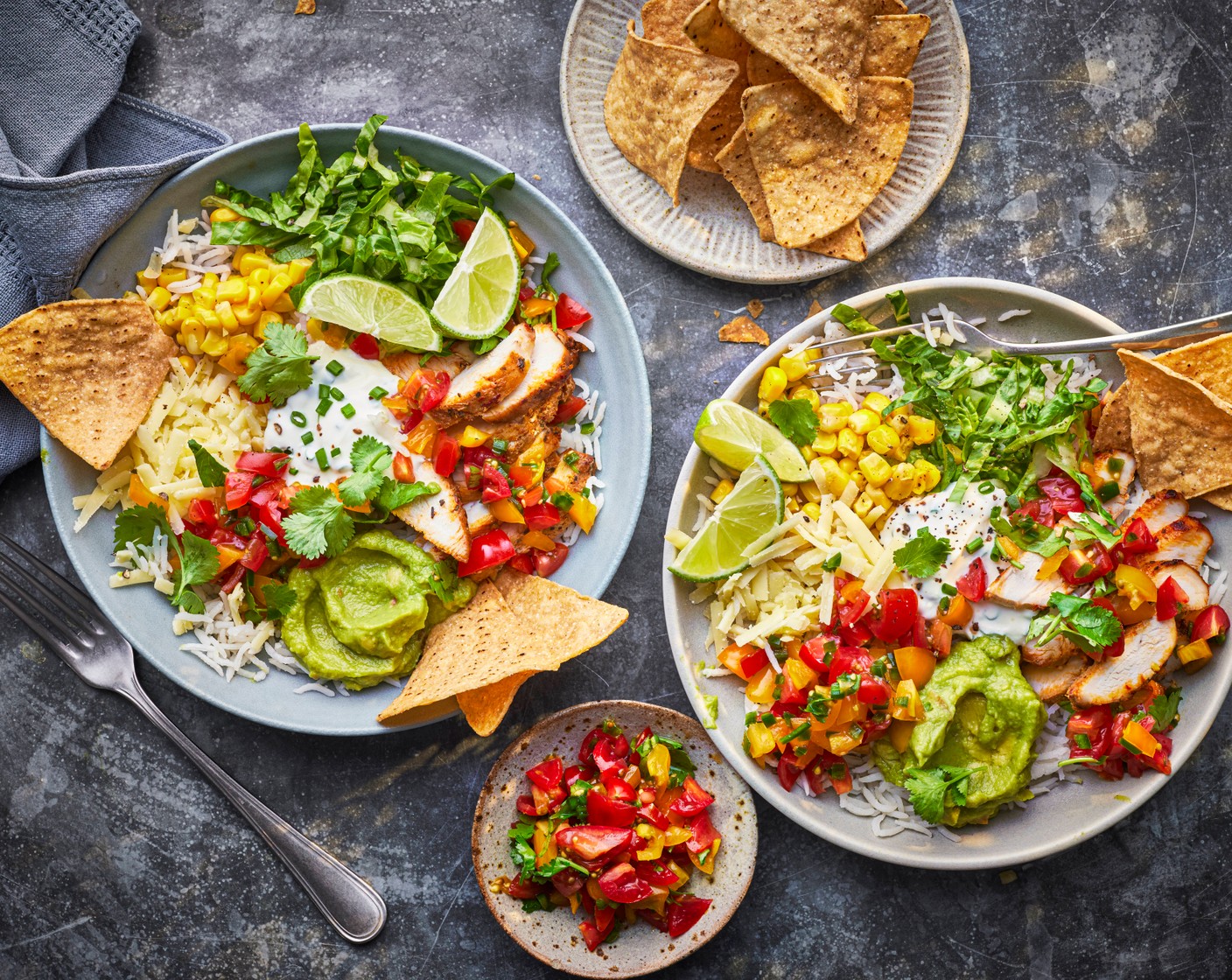 step 3 Add the rice to a bowl, top with the sliced chicken (1/2 pack), smashed avocado (2 tbsp), sour cream and chive dip (2 tbsp), tinned sweetcorn (2 tbsp), little gem lettuce (1/2) and salsa. Serve with a wedge of lime (1/4) and cantina tortilla chips (as needed), if you like.