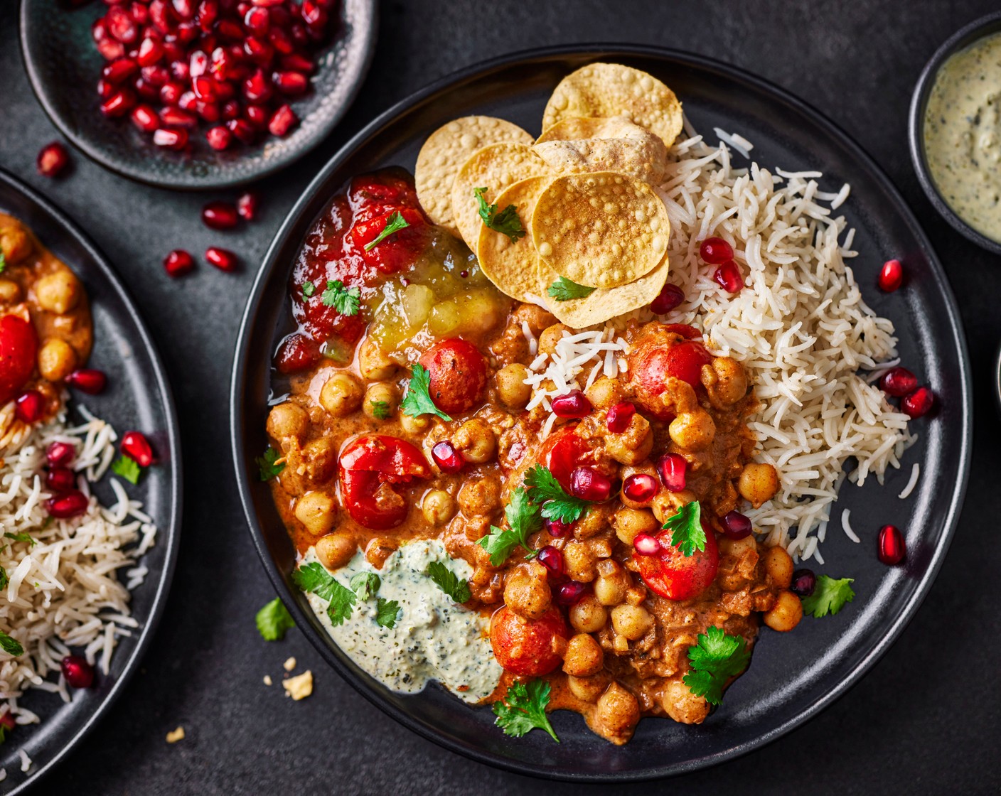 step 5 Serve the rice and chickpeas in bowls, topped with the extra cream. Scatter over the coriander (15 g) and pomegranate seeds (2 tbsp) and serve with the mango chutney poppadoms (200 g) and Indian dip selection (to taste).