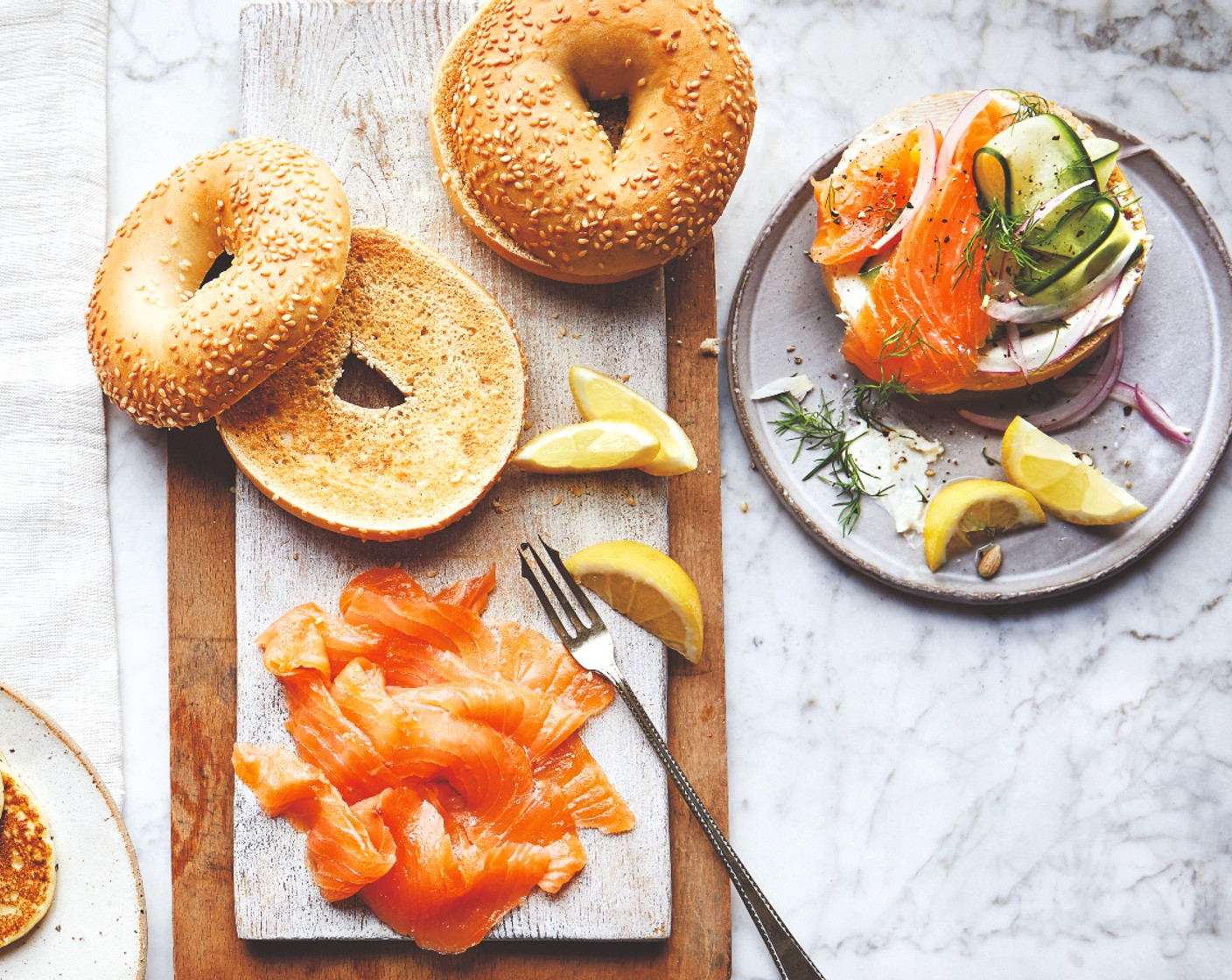 step 2 Toast the bagels (1 pack) and serve with the soft cheese (140 g), smoked salmon (1 pack), fresh herbs (1 handful) and lemon wedges (1) – let everyone dig in and help themselves.