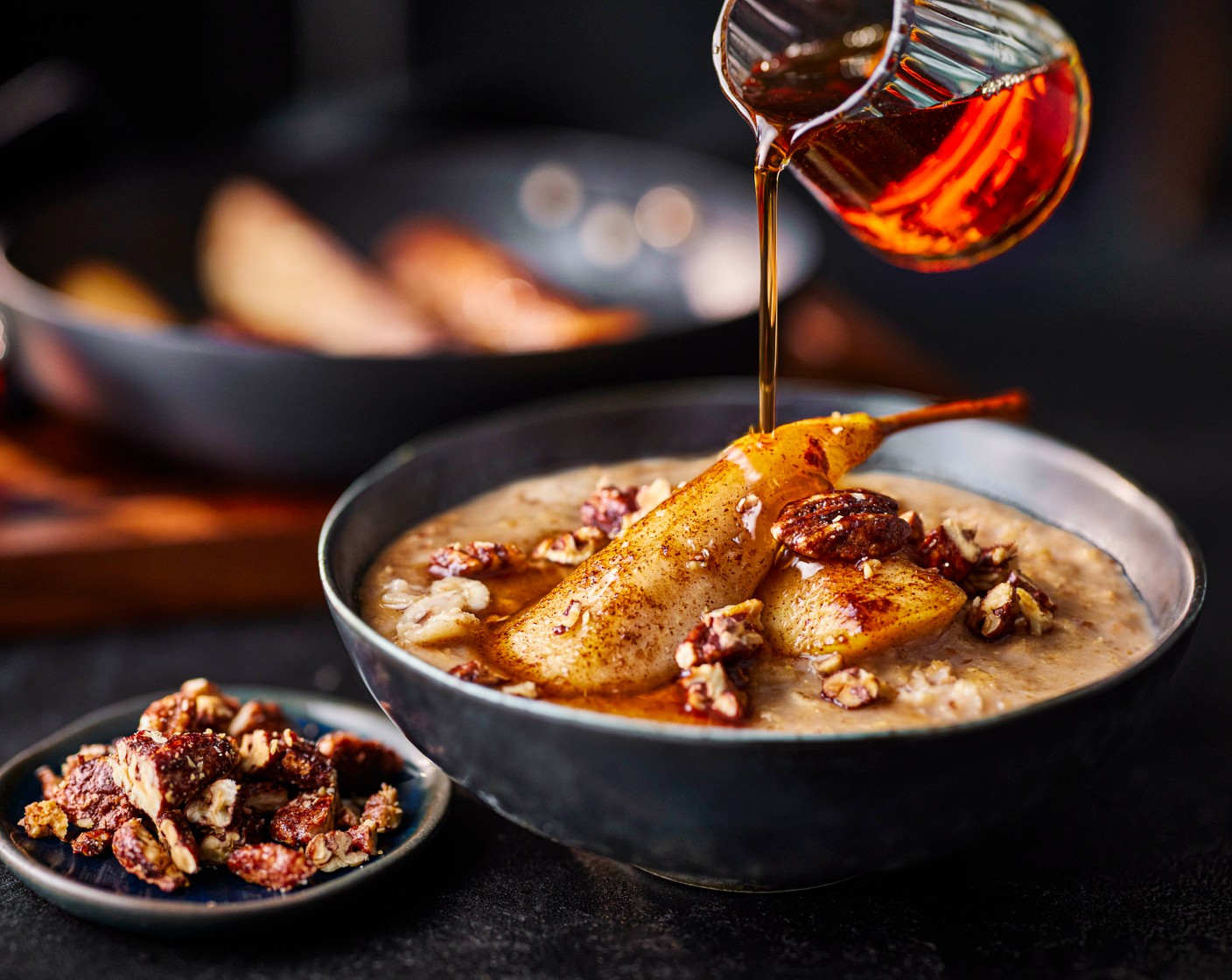step 4 Serve the porridge topped with the sticky maple pears, a drizzle of the maple butter from the pan, and a scattering of pecans (15 g).