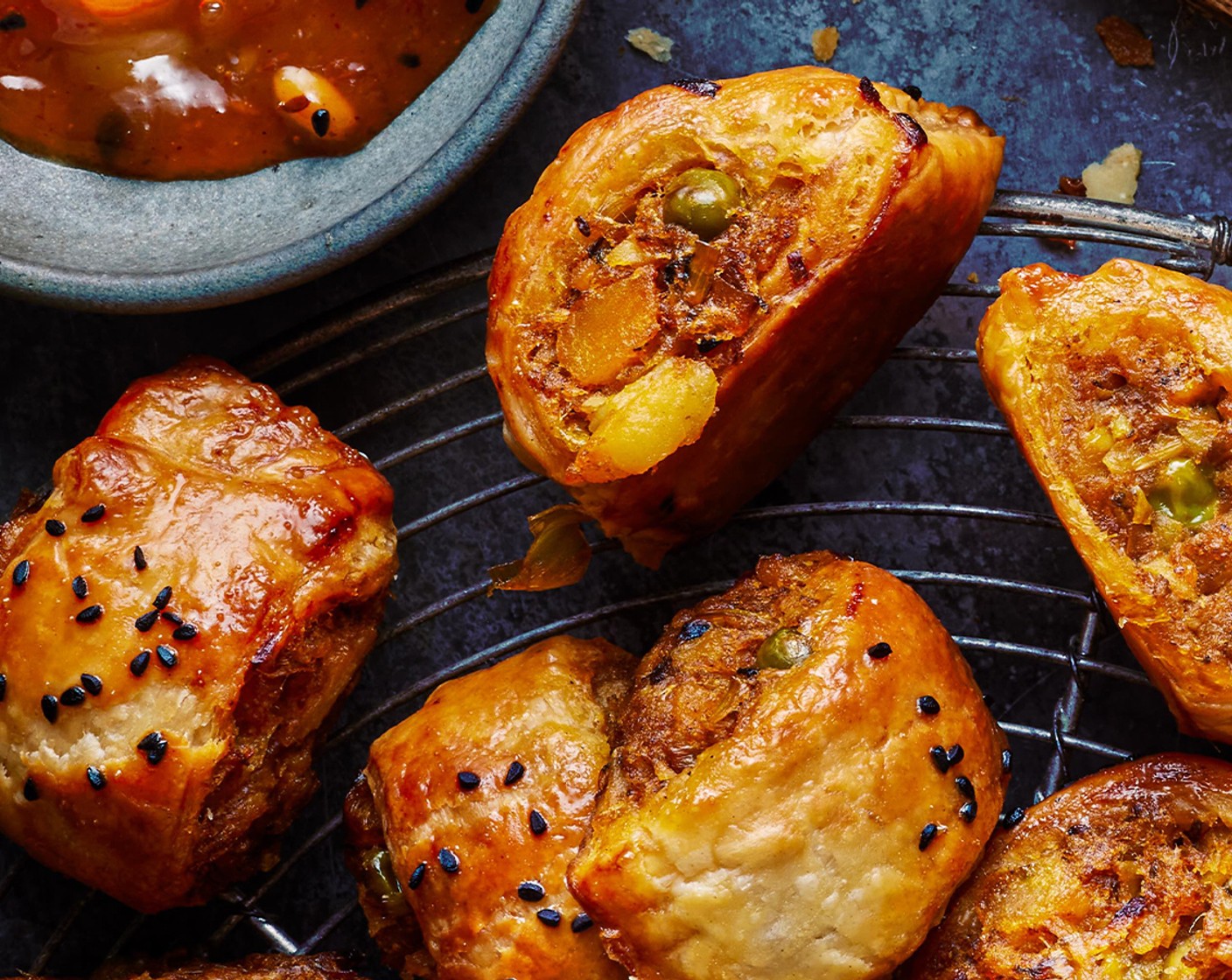 step 19 Arrange on baking sheet, lined with baking paper. Cook for 30 minutes, until golden and cooked through. Serve with mango chutney (2 tbsp).
