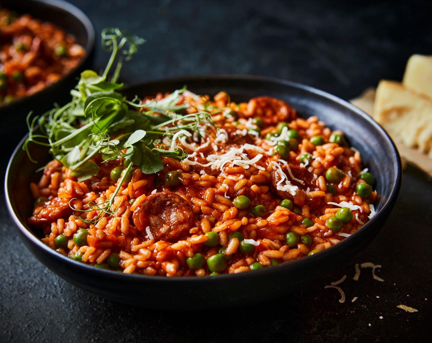 step 3 Remove the risotto from the heat and stir in the parmesan (80 g). Serve in bowls, topped with the pea shoots (1 handful).