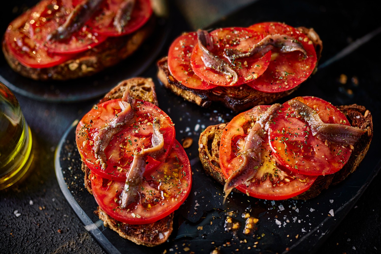 Herby tomato and anchovy sourdough toasts