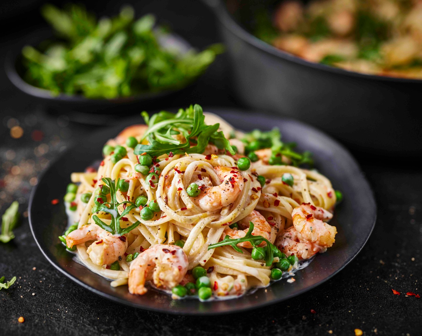 step 6 Serve the pasta in bowls, topped with a handful of rocket (1 handful) and an extra crack of black pepper.