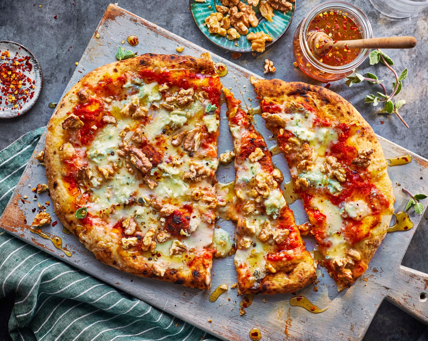 step 2 Meanwhile, heat the M&S wildflower honey (1 tbsp) and chilli flakes (1 tsp) with a sprinkle of salt in a small frying pan or sauce pan. When the pizza is ready, drizzle with the hot honey and serve.