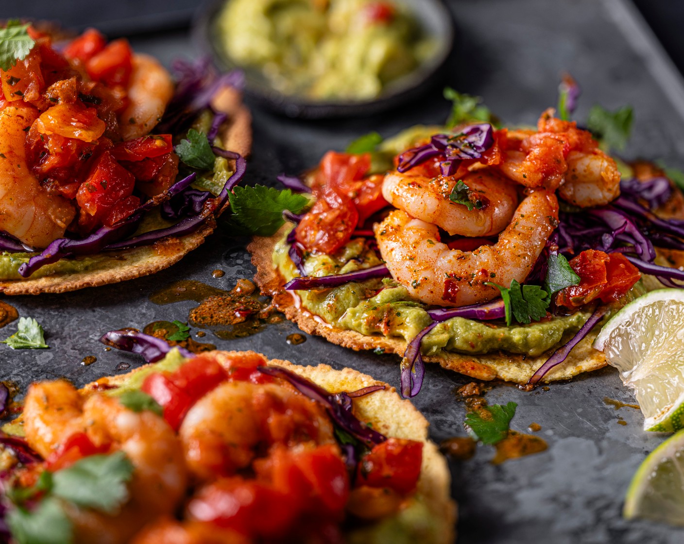 step 4 Top the tostadas with guacamole (1 tub), cabbage, prawns and tomato salsa (1 tub). Top with extra coriander, if you’d like.