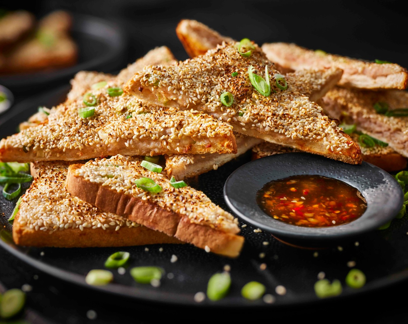 step 7 Cut the chicken toasts into triangles and serve warm with sweet chilli sauce (2 tbsp) for dipping.