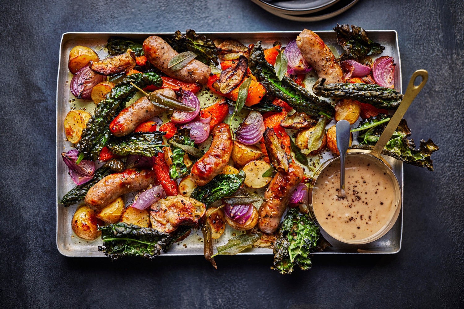 Sausage, apple and sage traybake