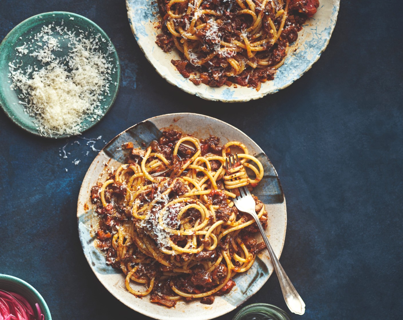 step 5 Cook the spaghetti (500 g) according to instructions. Toss with the ragu. Serve in bowls topped with the parmesan (to taste).