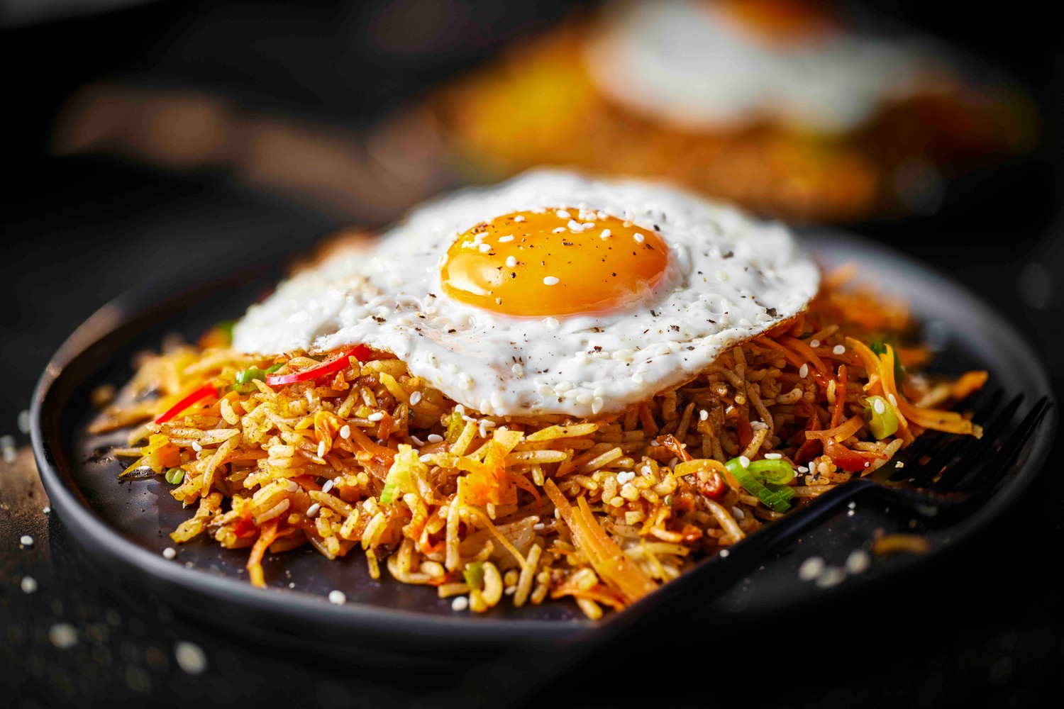Speedy carrot fried rice with crispy eggs