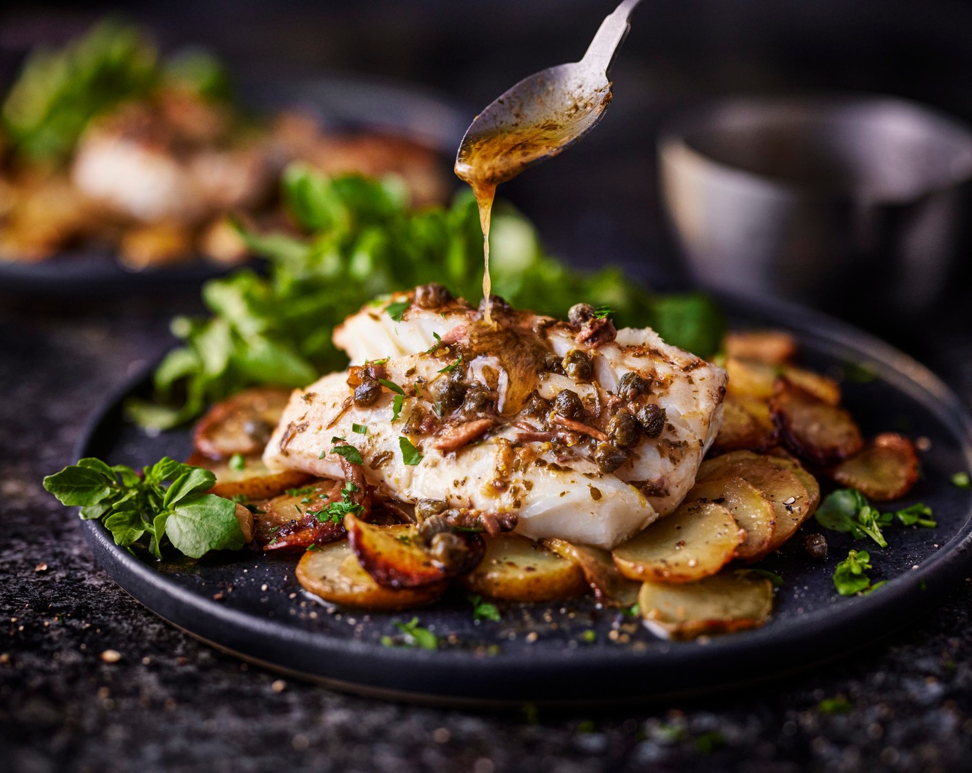 step 5 When you’re ready to serve, gently warm the remaining garlic and anchovy butter and pour over the fish and scatter over the parsley (1 handful) and serve with the lemony watercress.