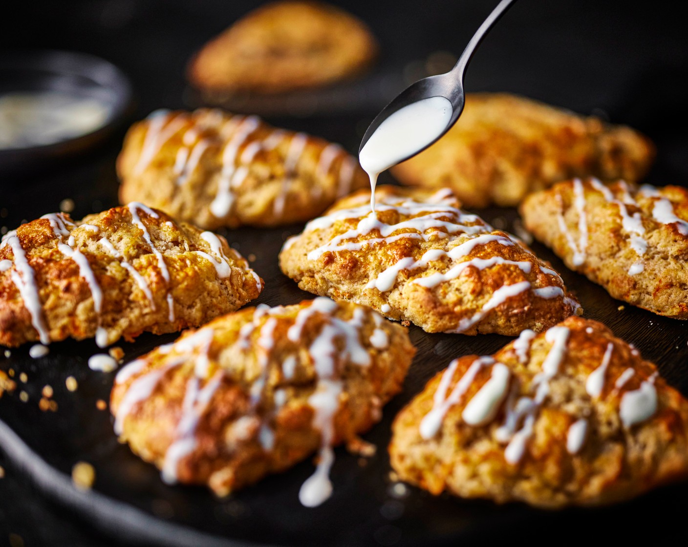step 8 Once the scones are baked, allow to cool slightly, then drizzle with the glaze and serve.