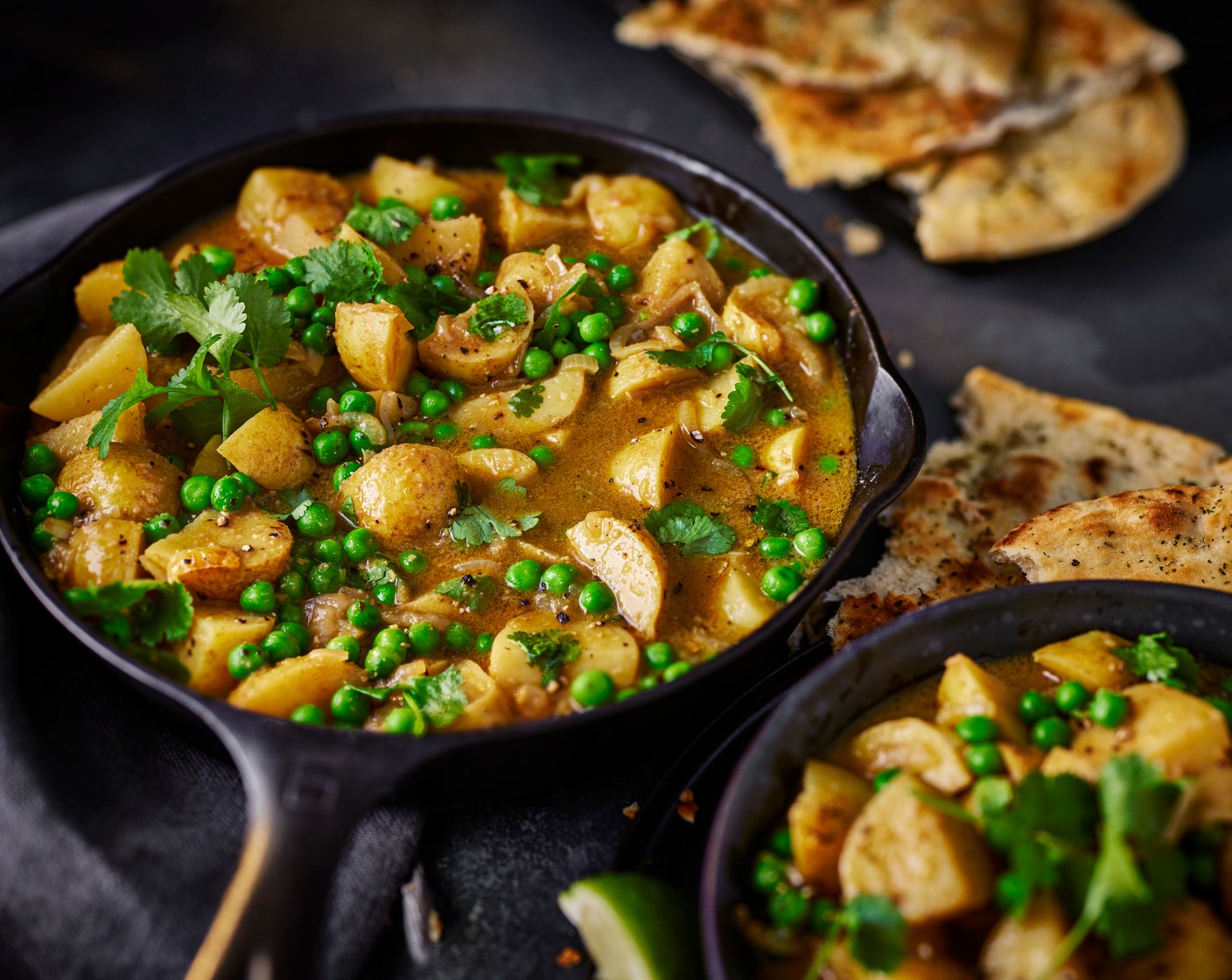 step 4 Stir the peas (300 g) into the curry and cook for 1 minute. Serve with the naan bread, lime wedges (1) and fresh coriander (1 handful) on top.