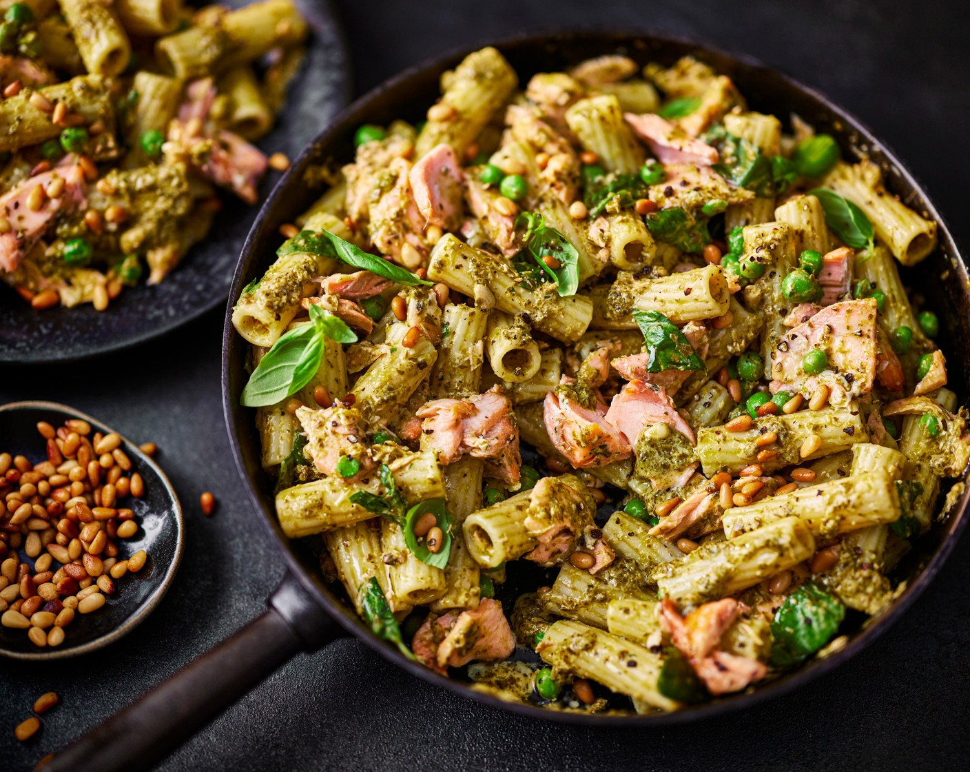 step 4 Serve the salmon pasta in bowls and top with the pine nuts (1 tbsp) and basil (15 g).