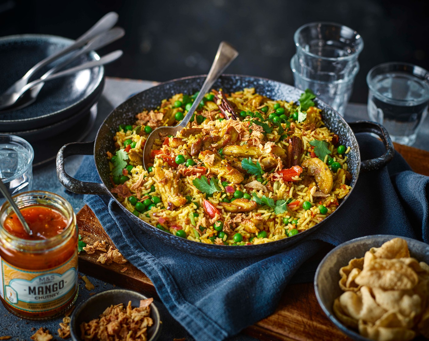 step 6 Fluff up the rice with a fork and serve into bowls with poppadoms (to taste) and mango chutney (to taste) alongside. Garnish with chopped coriander (2 handfuls) and crispy onions (1/2 tub).