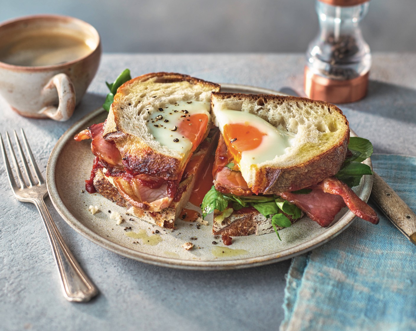 step 4 Remove the whole slices of sourdough from the pan and place onto plates. Smear the slices with butter (1 tsp) and tomato sauce (to taste), then layer with three rashers of bacon and a few sprigs of watercress (1 handful) each. Top with the egg-filled bread slices to serve.