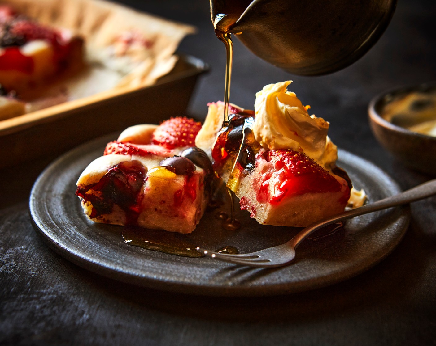 step 6 Serve the pancake traybake, cut into squares, with the orange clotted cream, fresh berries and a drizzle of maple syrup (3 tbsp).