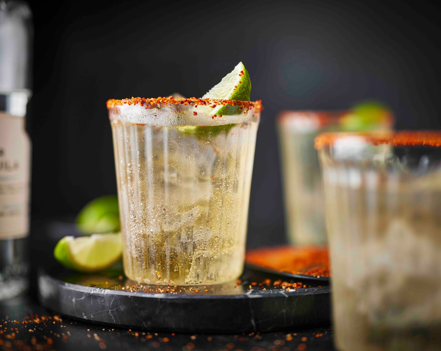 step 2 To serve, pour the Tajin (3 tbsp) onto a plate. Run a lime wedge (2) around the edge of 6 high ball glasses, then dip each into the Tajin. Fill the glasses with ice (as needed) and pour over the beerita mix. Serve with an extra lime wedge, if you like.