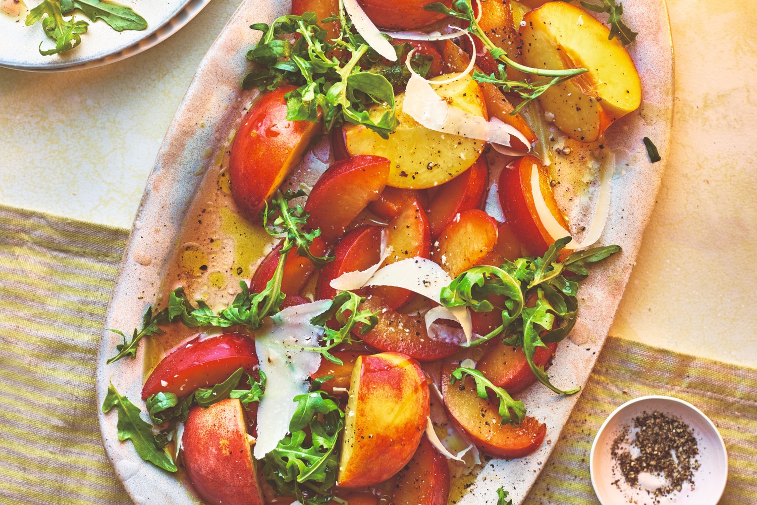 Plum, peach and rocket salad with pecorino and black pepper