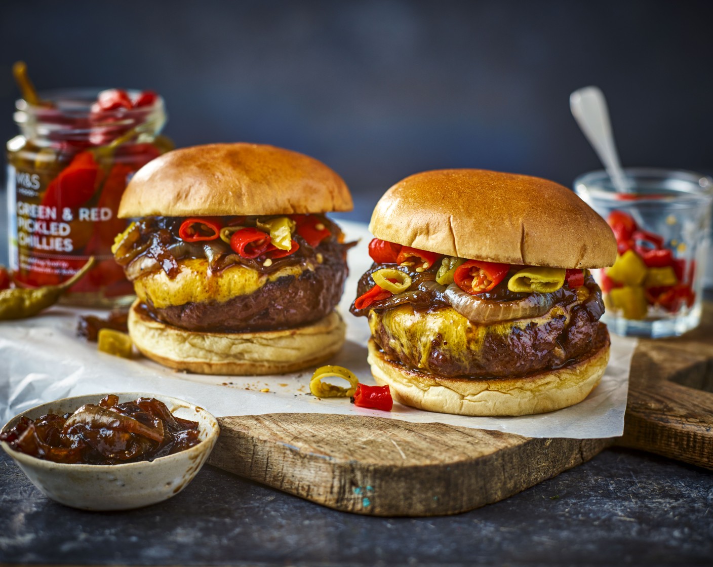 step 4 Lightly toast the buns (2), then place the cooked burgers onto the bases. Top each with the onions and chillies (6), then top with the other bun halves. Serve with your favourite condiments, if you like.