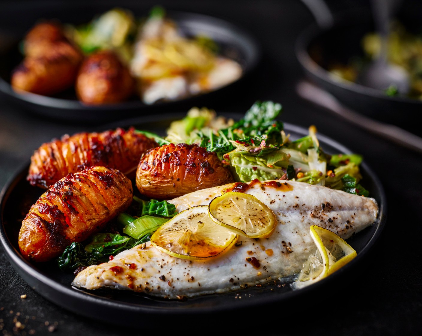 step 6 Serve the fish and potatoes with the anchovy and chilli greens.