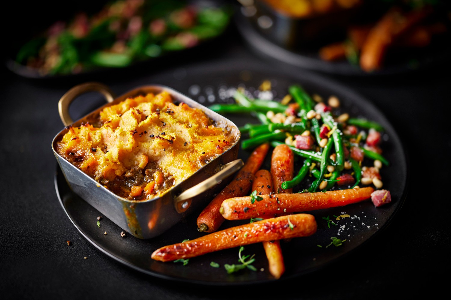 Sweet potato shepherd's pie with curried lamb, glazed carrots and green beans recipe