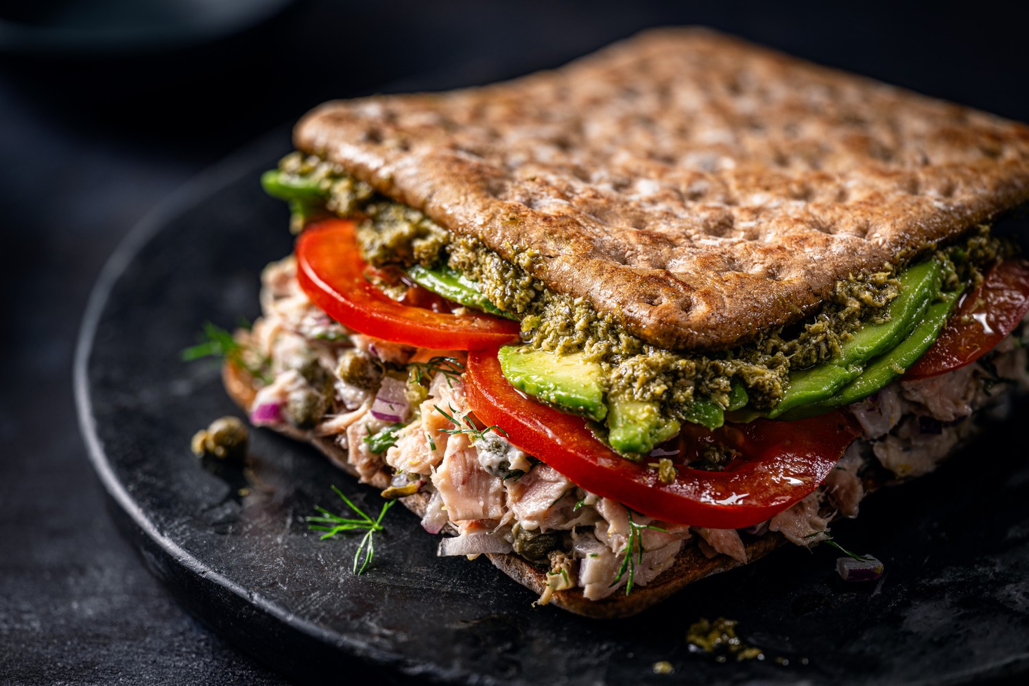 Tuna, avocado and tomato pesto sandwich