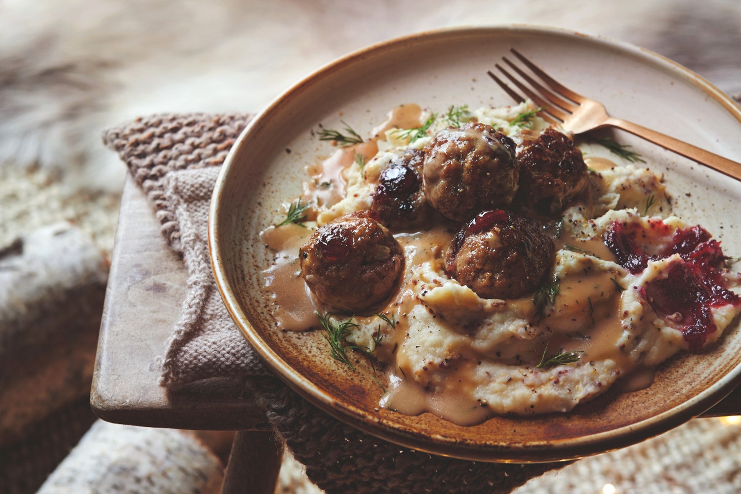 Cranberry meatballs with a creamy vodka and dill sauce and mustard mash