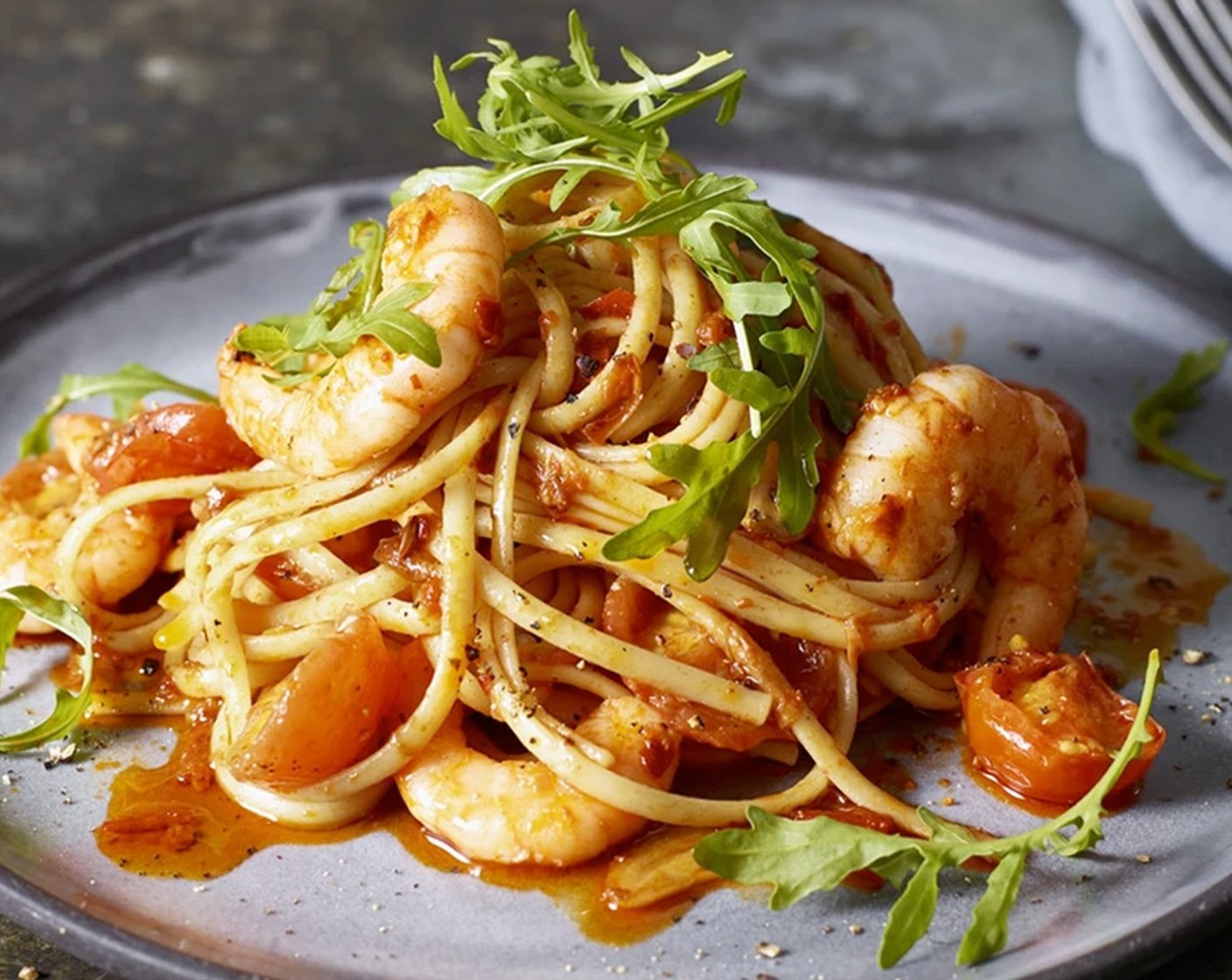 step 4 Toss everything together until the pasta is perfectly cooked and the sauce is glossy, then add the parmesan (50 g) and toss through the sauce. Spoon into bowls and serve with a handful of rocket (4 handfuls) in each one.