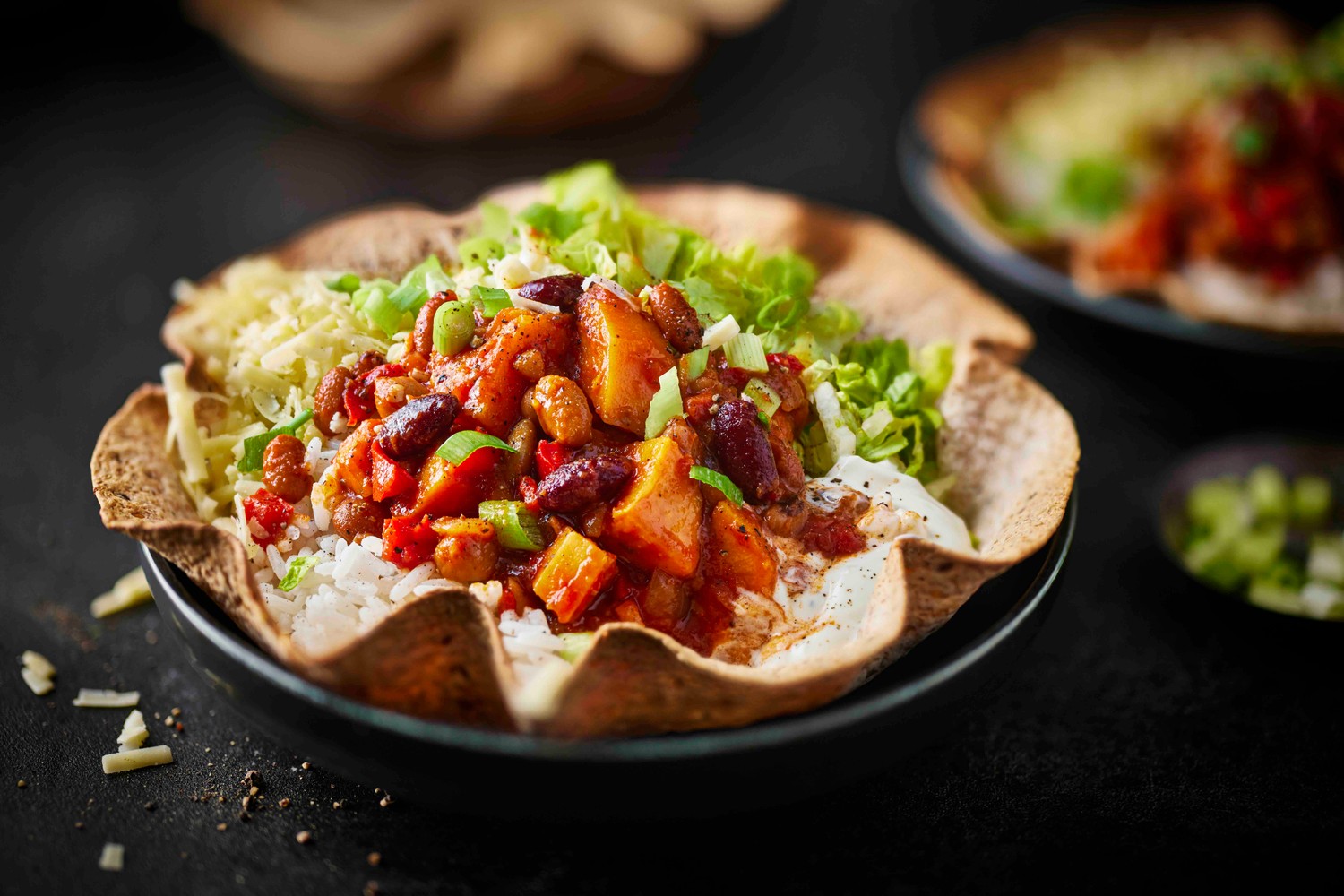 Vegetarian sweet potato and bean chilli tortilla bowls