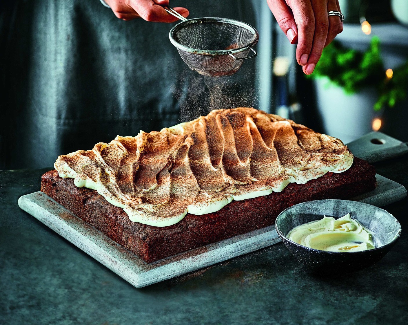 step 9 Once the cake is cool, spread frosting on top, sprinkle over the mixed spice (1/4 tsp) and cut into squares.