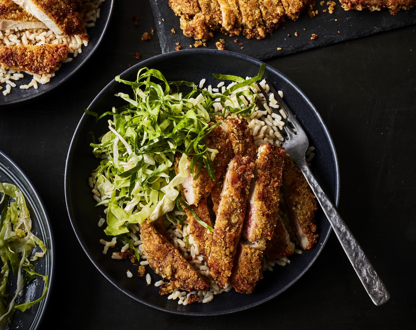 step 6 Cook the rice (2 packs) according to the pack instructions. Divide the rice and the cabbage slaw between four serving bowls. Slice the baked katsu pork, add to the bowls and serve.